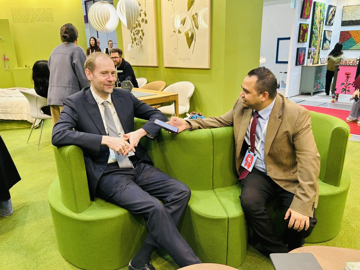 Joachim Arup Fishcher (left), commercial counsellor, interacts with a Korea Herald reporter at the Denmark Pavilion at the 2025 Seoul Living Design Fair in the Coex Convention Center in Seoul. (Sanjay Kumar/ The Korea Herald)