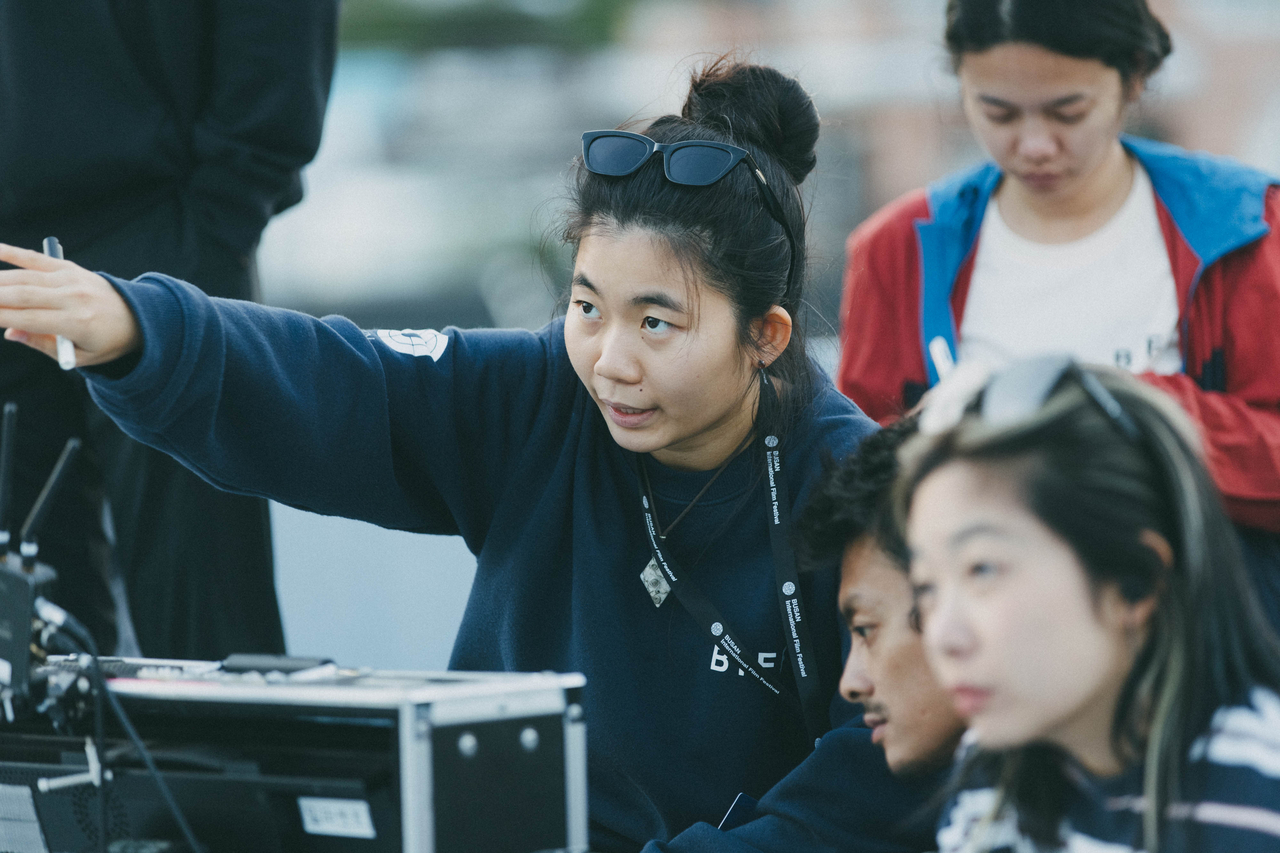 Participants collaborate during a filming session at the 2024 Chanel X BIFF Asian Film Academy (BIFF)