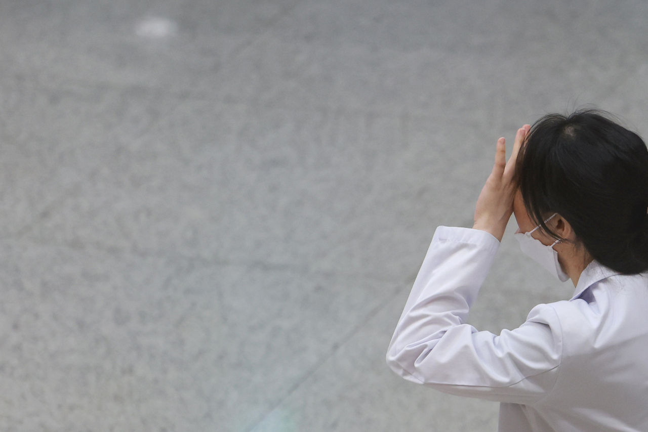 A health care professional is seen inside a teaching hospital on Sunday. (Yonhap)