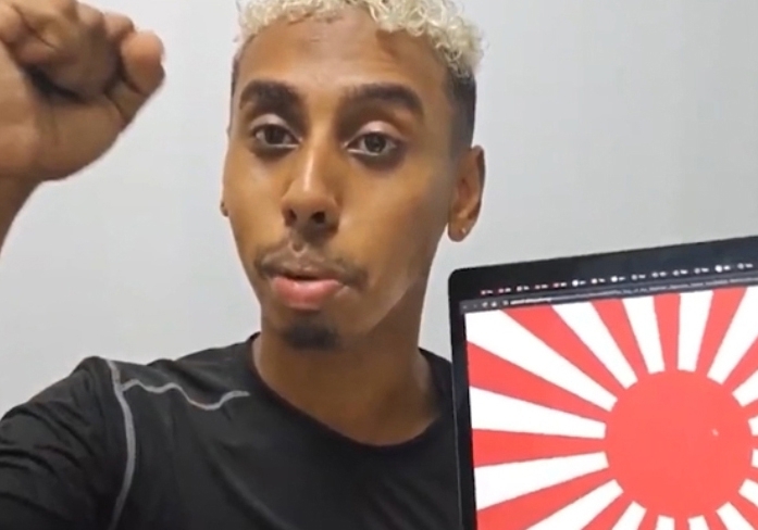 Screenshot of from the video in which the YouTuber who calls himself Johnny Somali shows the Rising Sun Flag (Johnny Somali YouTube channel)