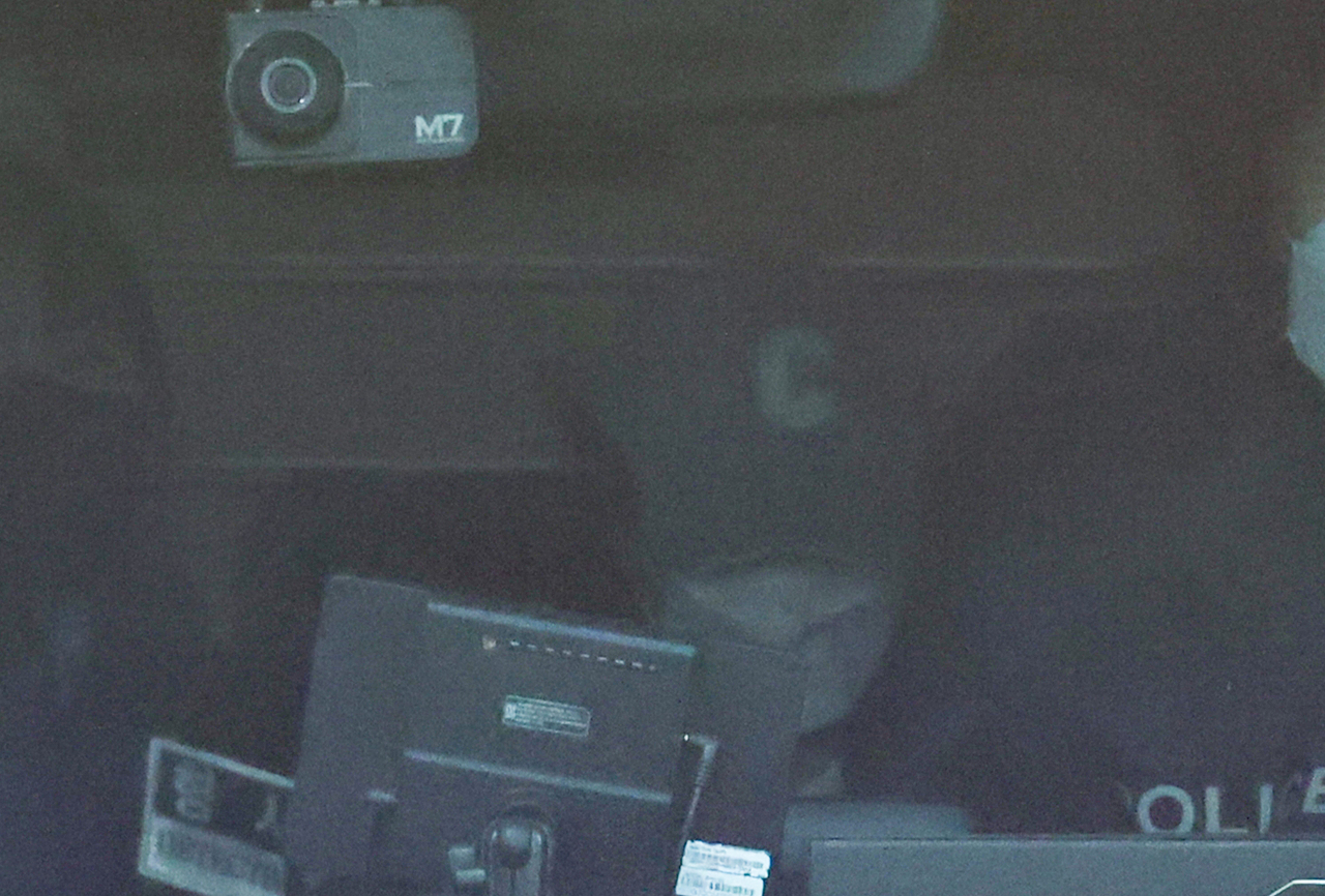 A teacher in her 40s surnamed Myung, who allegedly killed a Daejeon elementary school student, is moved to a detention center in a police van after completing her first face-to-face interview at the Daejeon Seobu Police Station on Friday. (Yonhap)