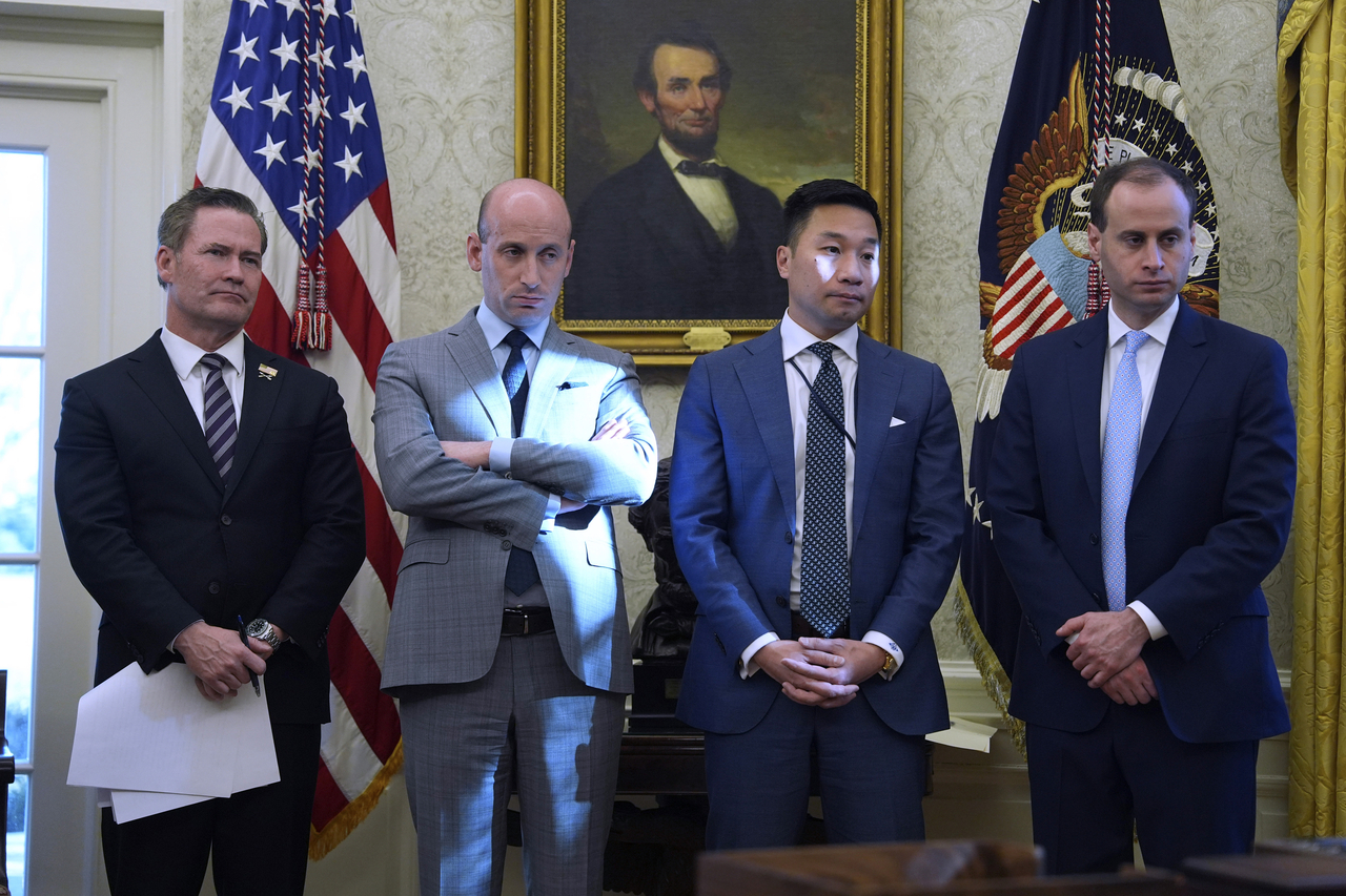 From left: White House national security adviser Mike Walz, adviser Stephen Miller, deputy national security adviser Alex Wong and staff secretary Will Scharf listen as US President Donald Trump speaks to reporters as he signs executive orders in the Oval Office of the White House, Feb. 4, in Washington. (AP)
