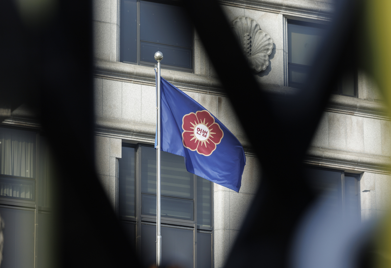 The flag of the Constitutional Court is seen outside the court building in Seoul on Tuesday. (Yonhap)