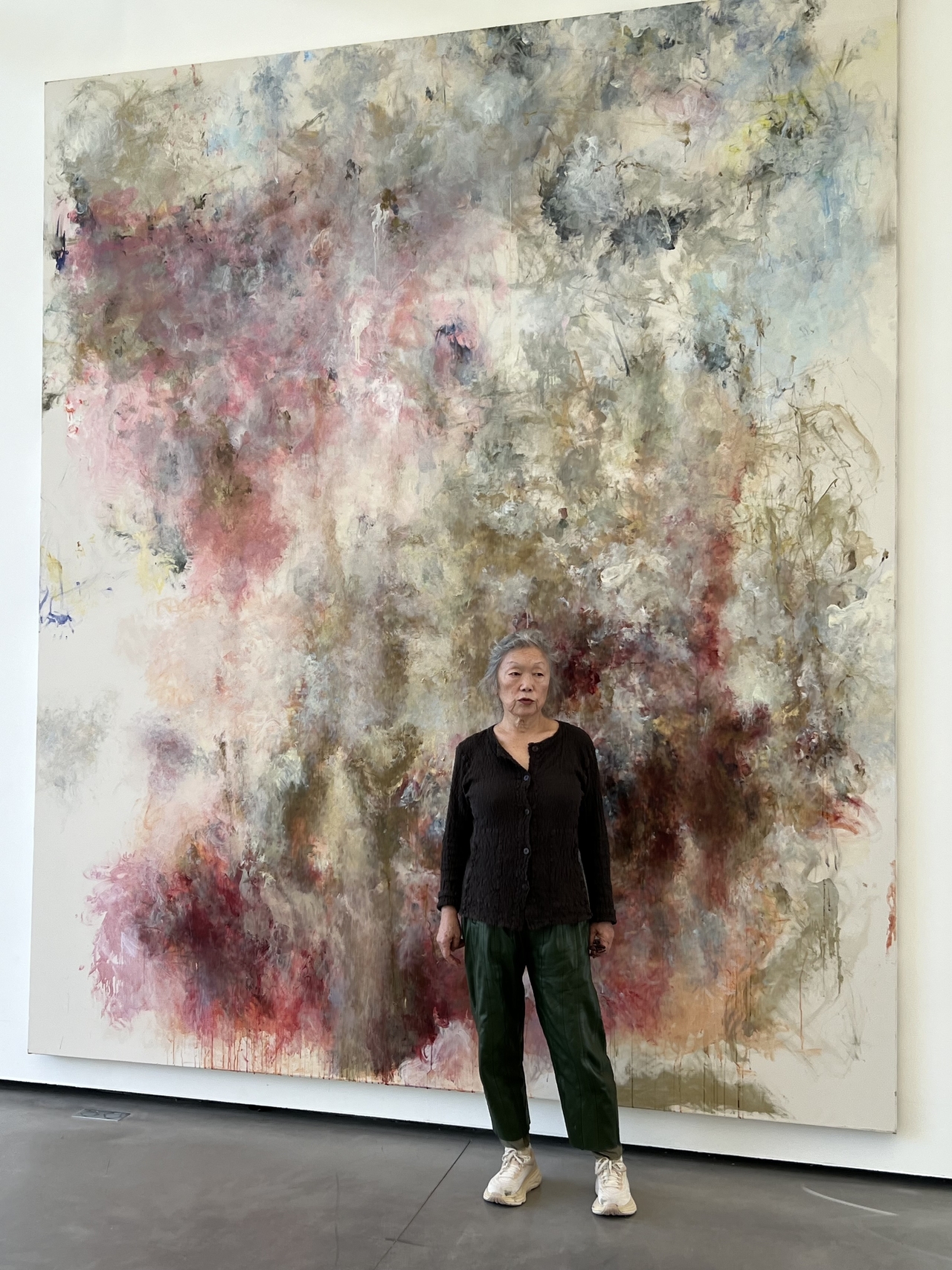 Kang Myong-hi poses for a photo in front of her painting "Requiem," completed last year. (Courtesy of the artist)
